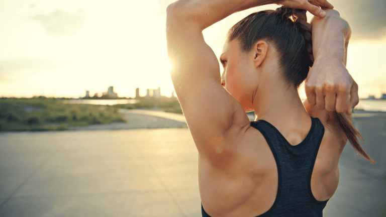 Athletic Woman Warming up before a Workout