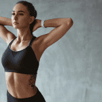 Fitness Woman Stretching Arms In Stylish Black Sport Clothes