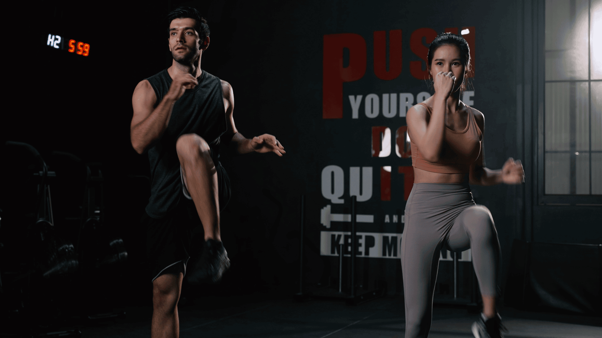 Sporty Couple Cardio Exercise Burning Fat HIIT and Squat in Fitness Gym Fit Body Healthy Lifestyle
