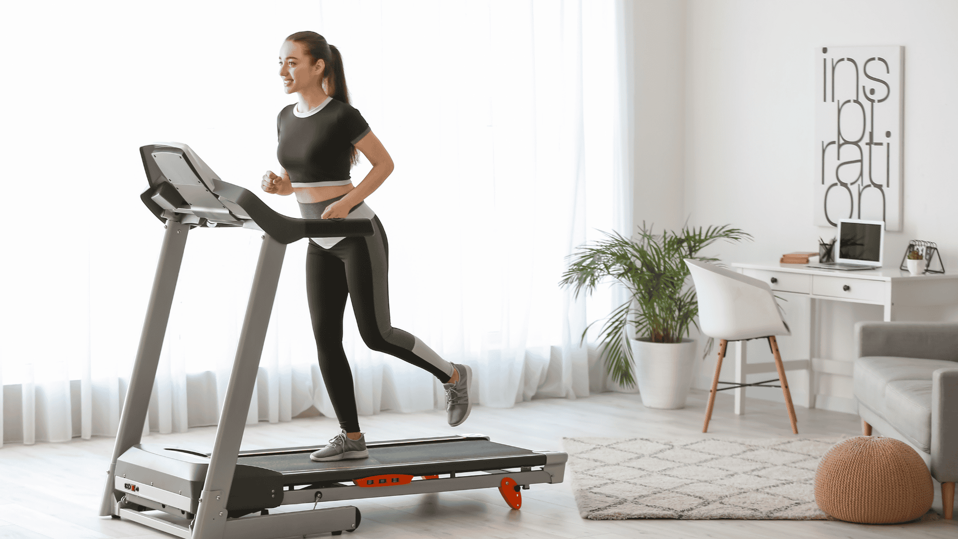 Sporty Young Woman Training on Treadmill at Home