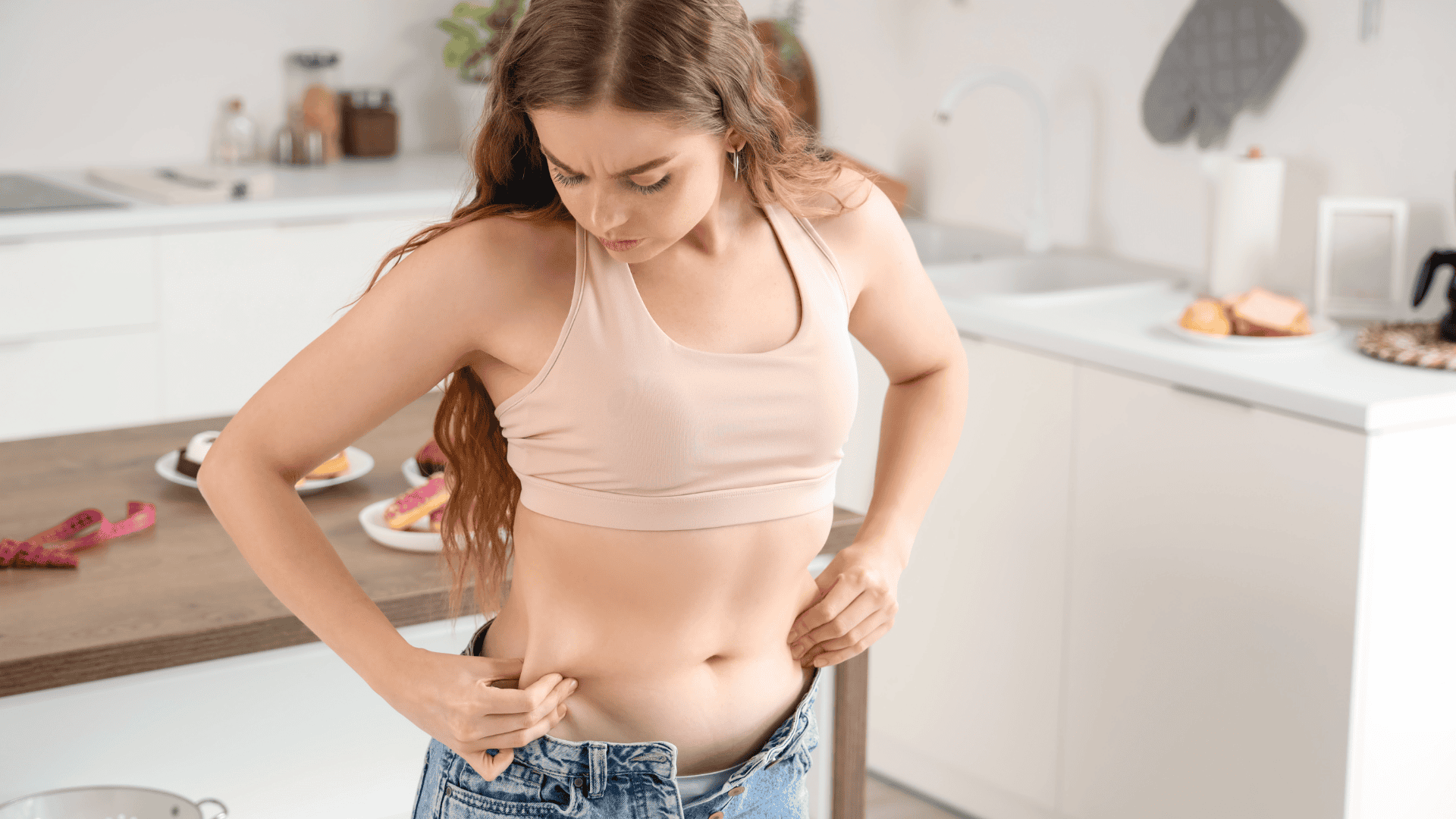 Woman Pinching Her Belly Fat