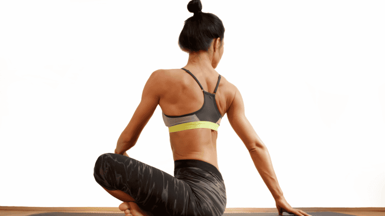 Woman stretching her back