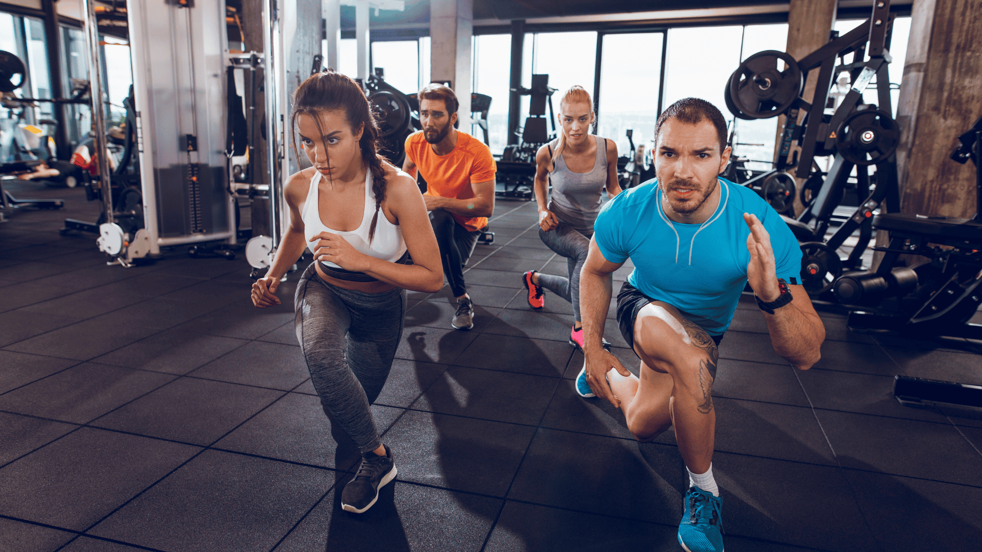 Young people doing crossover reverse lunges