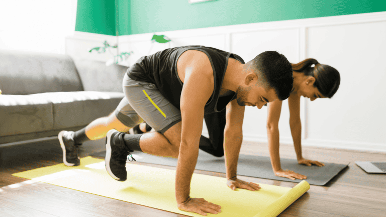 Young woman and man doing a HIIT workout
