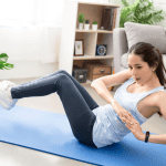 A woman doing Russian twists at home