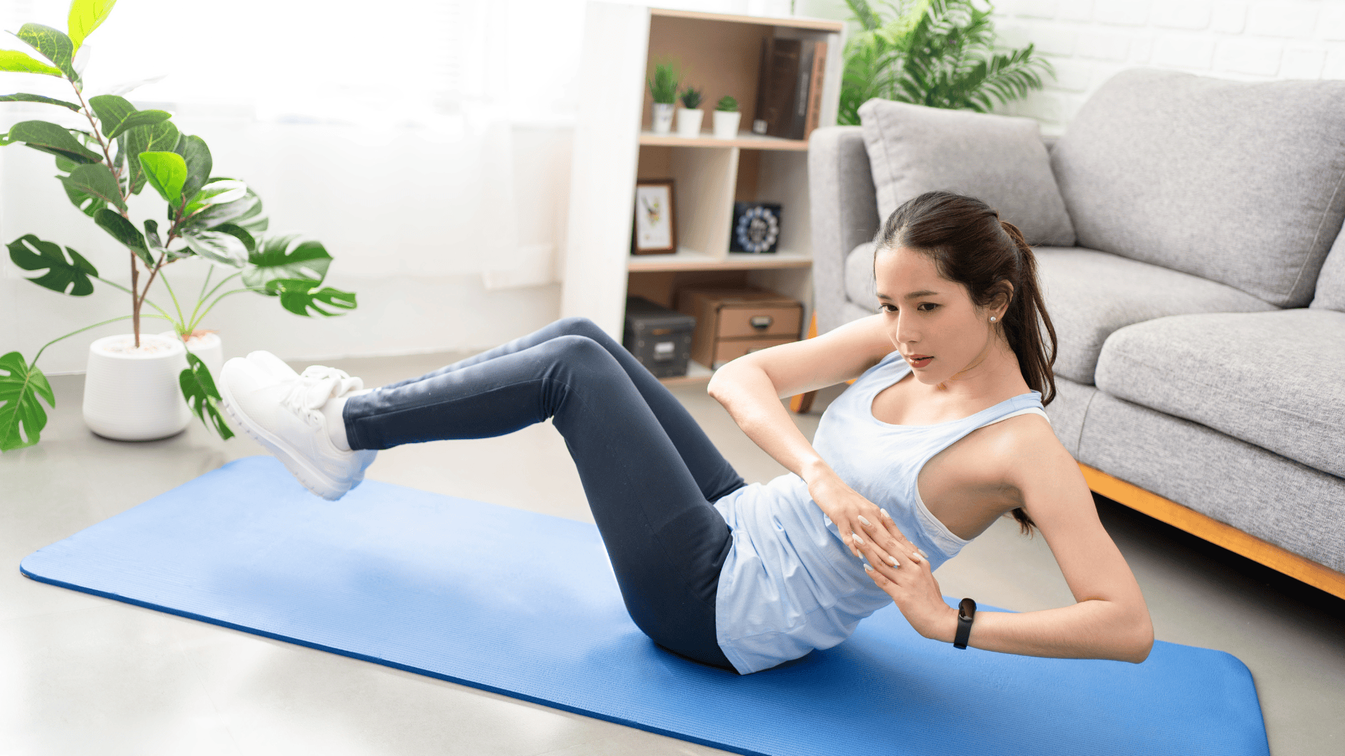A woman doing Russian twists at home