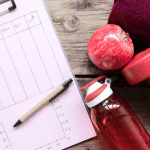 workout plan with sneakers, smartphone and other fitnes