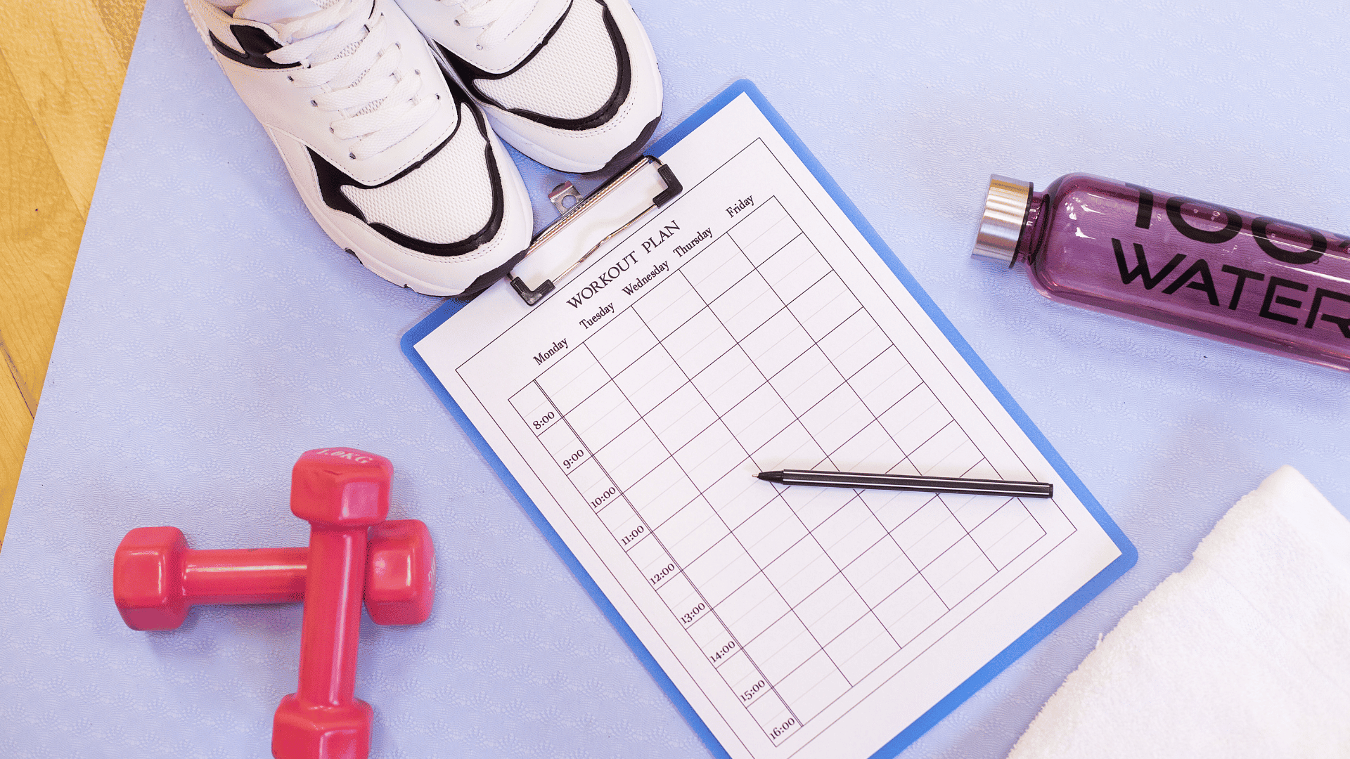 AN Overlay Template - 2025-08-05T170159.258 Flat lay of essential workout items on a yoga mat: a blank weekly workout plan clipboard, pink dumbbells, white sneakers, a purple water bottle labeled "100% WATER," a pen, and a white towel — symbolizing preparation and motivation for a successful fitness routine. Ask ChatGPT
