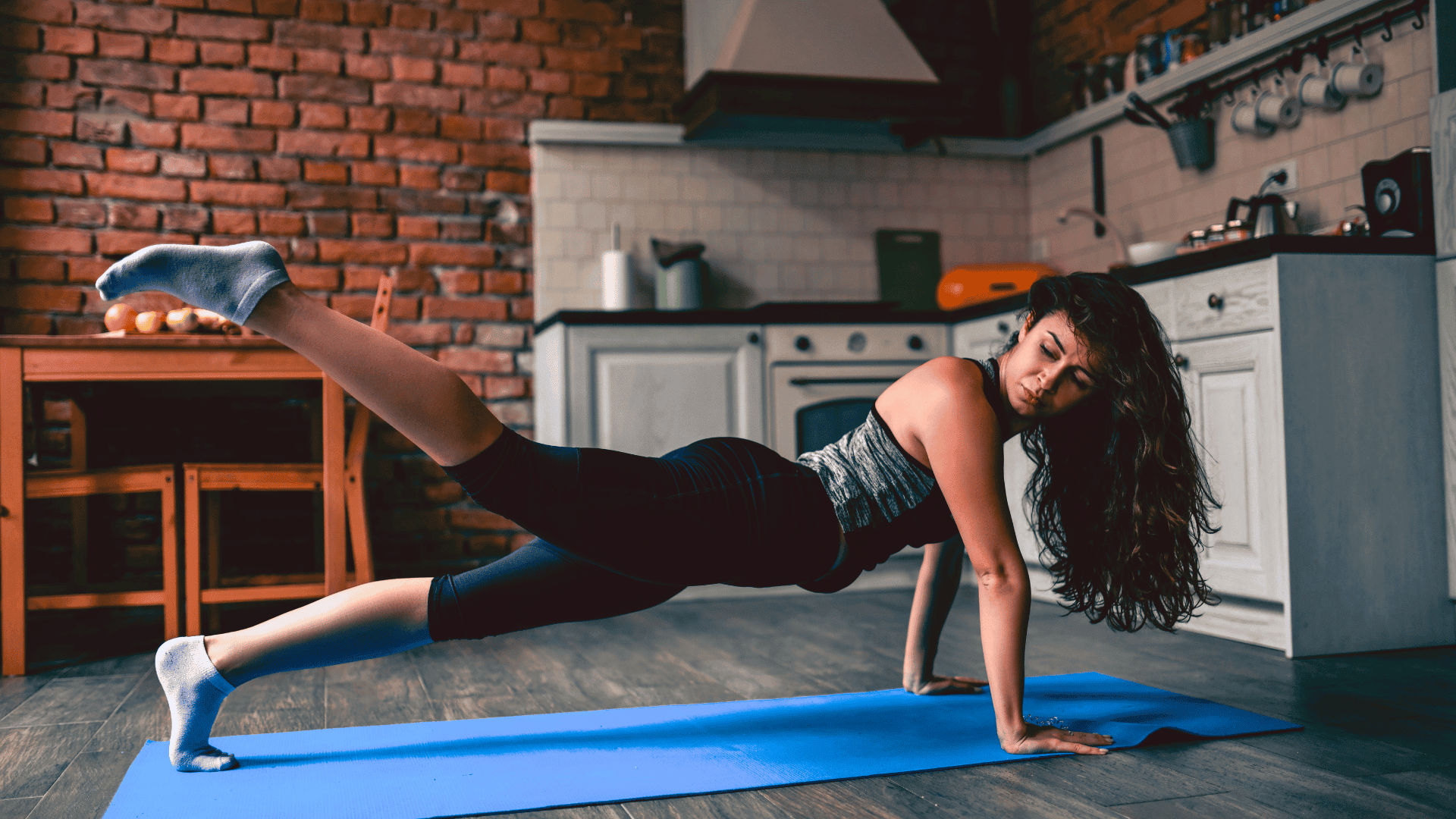 Female Doing Calisthenics At Home Kitchen