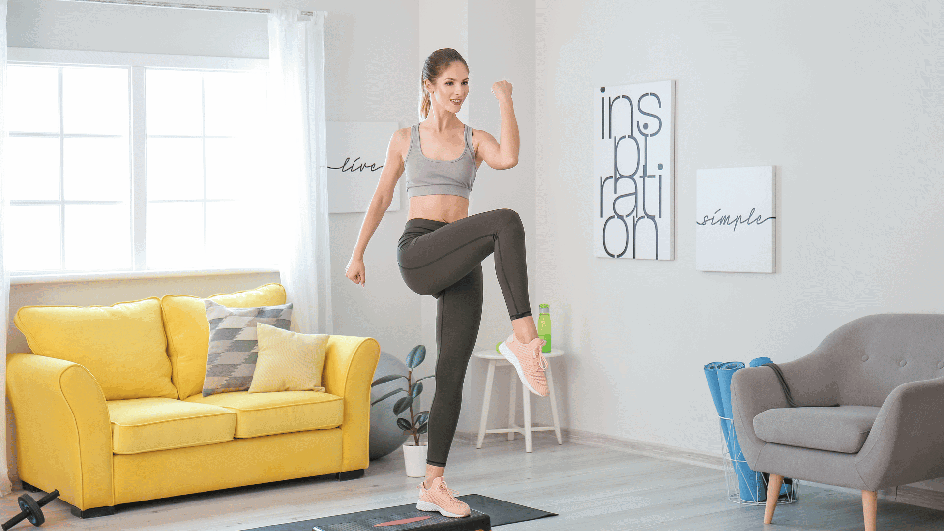 Woman performing a home workout in a bright living room, mid-motion in a total body burn exercise.