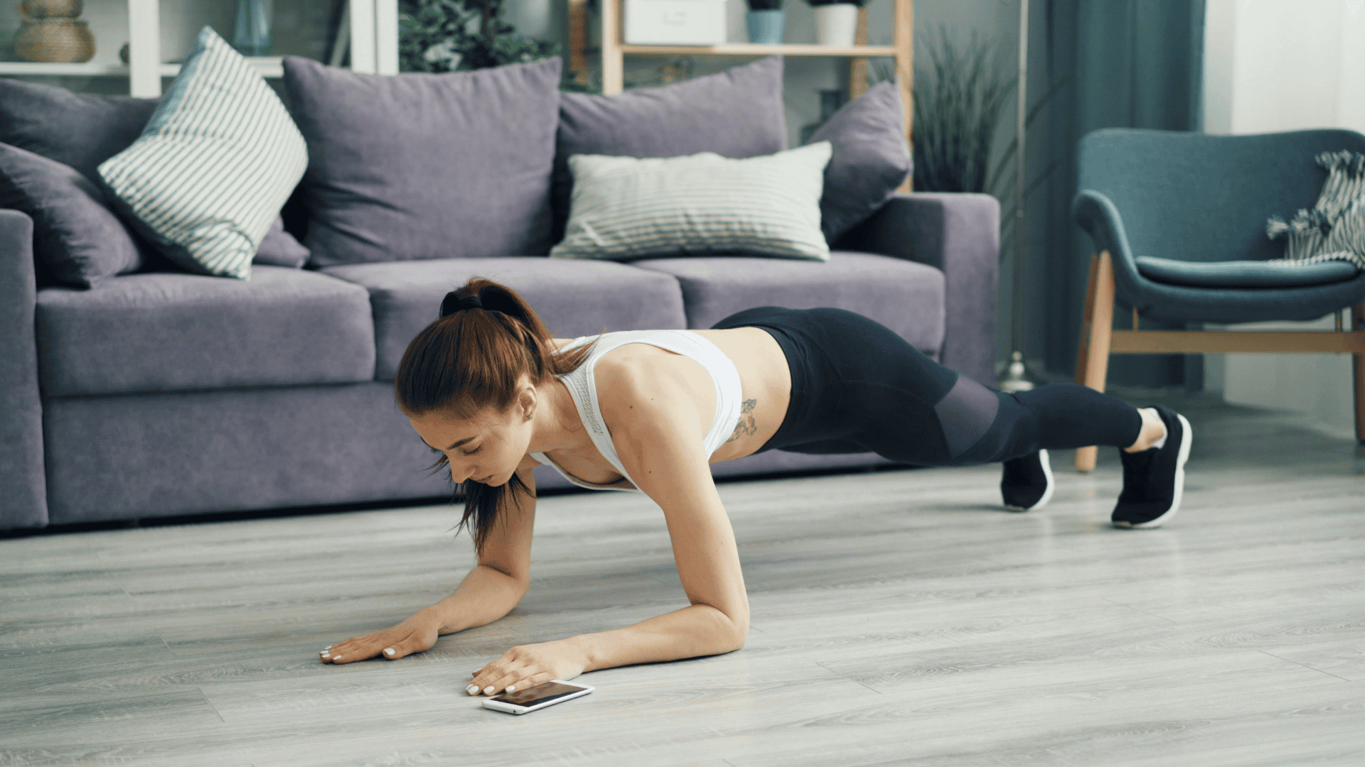 Woman Exercising Plank on Floor
