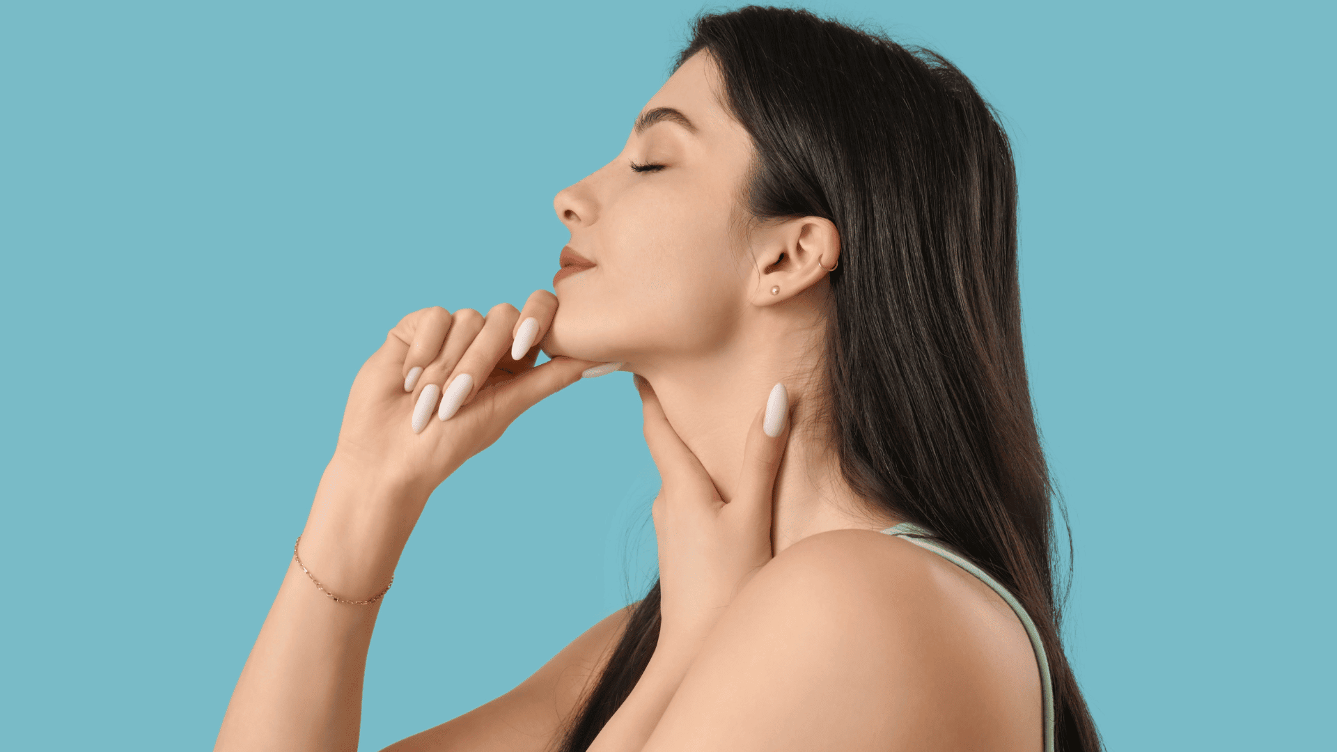 oung woman practicing a jawline-defining face yoga pose, tilting her head back and gently pressing under the chin and along the neck to tone the jaw and neck area.