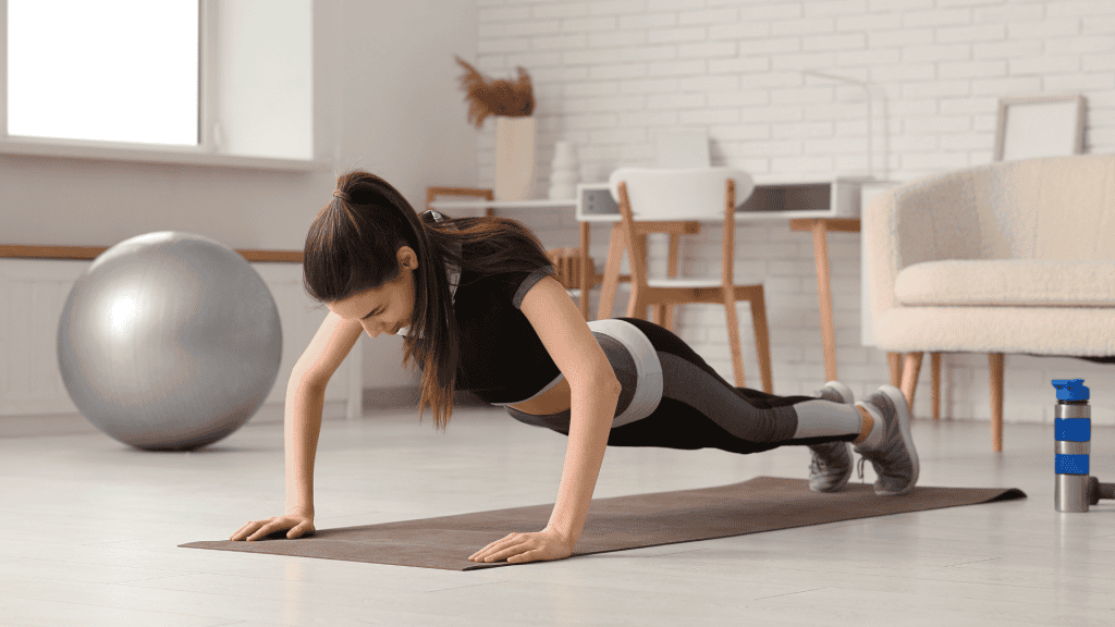 Push-up exercise at home with a woman on a yoga mat 