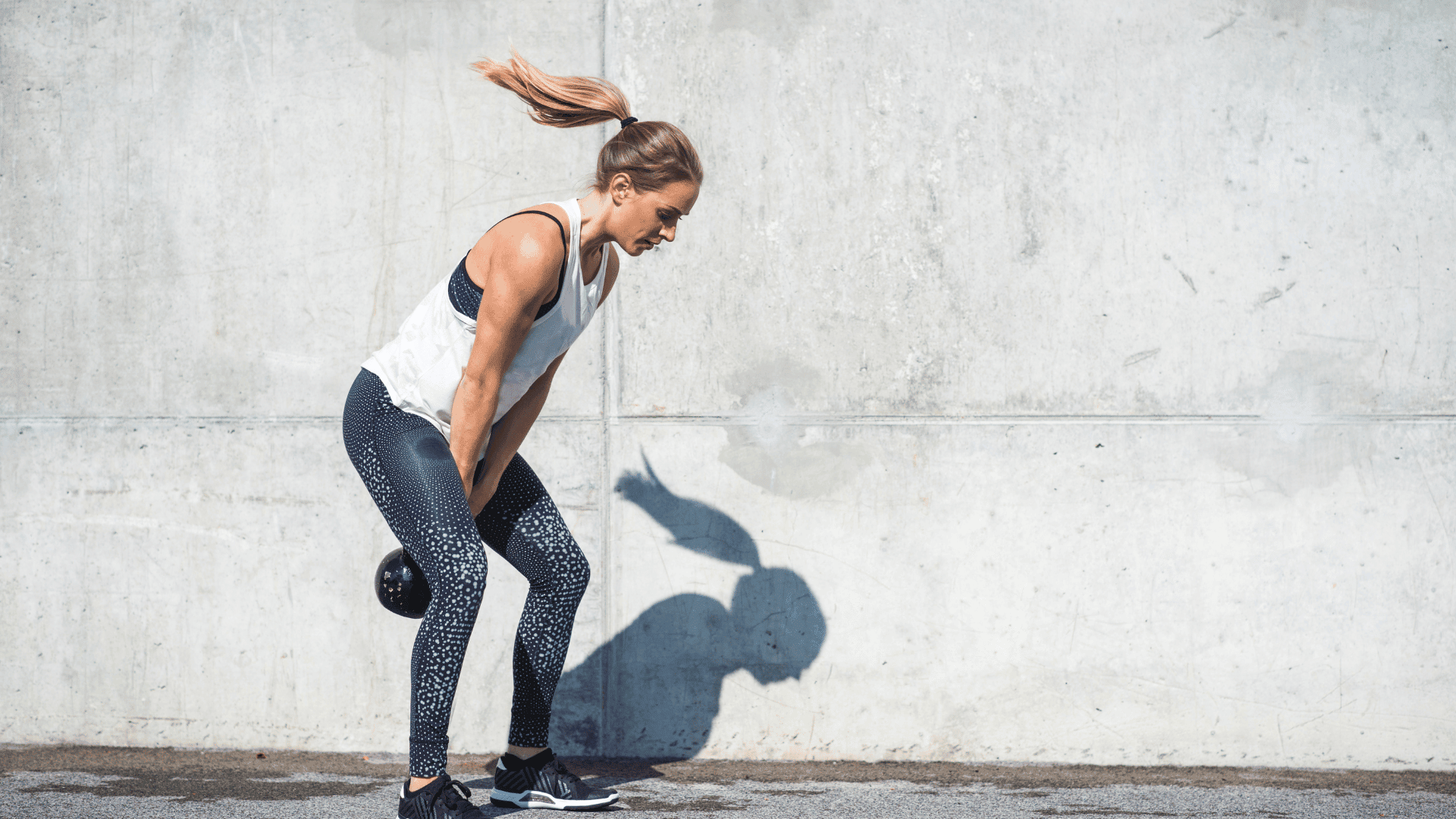 Woman doing kettlebell swings